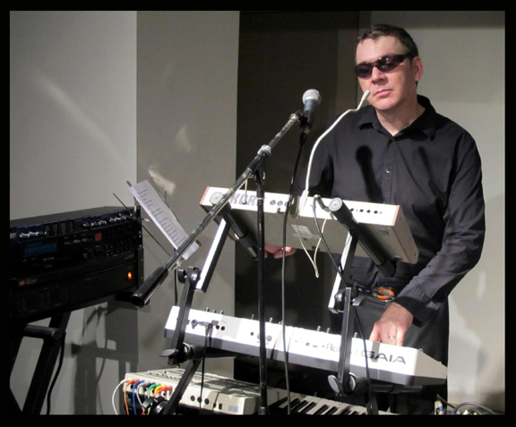 A crowd watches as Jess Hyperbubble plays the theremin
